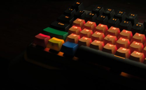 orange, black, and green mechanical keyboard